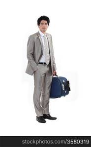 Businessman stood with luggage