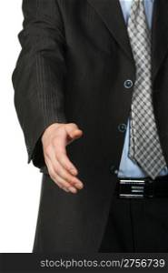 Businessman stretching out hand.Focus on hand, suit and tie blurred in background