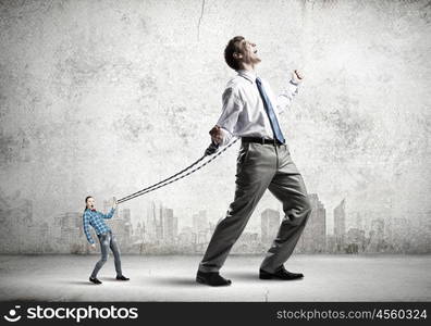 Businessman struggling with problems that occur on the way. Bound with responsibility