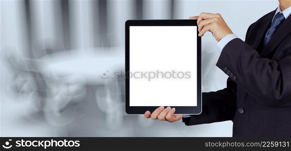 businessman success working with blank tablet computer his board room background as concept