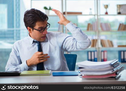 Businessman suffering from excessive armpit sweating. The businessman suffering from excessive armpit sweating