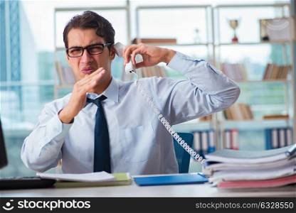 Businessman suffering from excessive armpit sweating. The businessman suffering from excessive armpit sweating