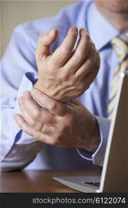 Businessman Suffering From Repetitive Strain Injury (RSI)