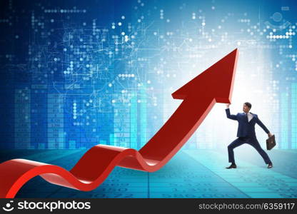 Businessman supporting growtn in economy on chart graph