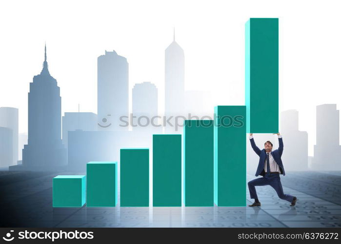 Businessman supporting growtn in economy on chart graph