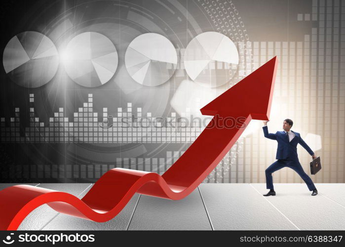 Businessman supporting growtn in economy on chart graph