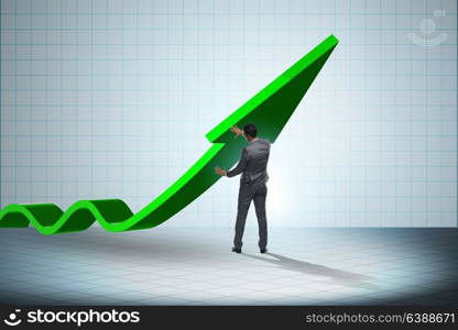 Businessman supporting growtn in economy on chart graph