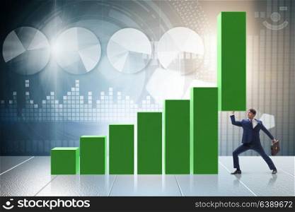 Businessman supporting growtn in economy on chart graph