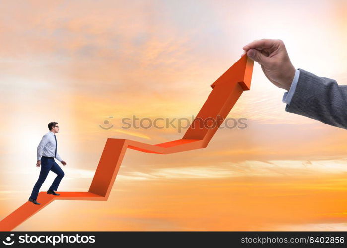 Businessman supporting growtn in economy on chart graph