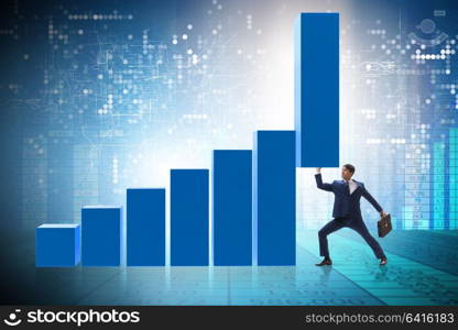 Businessman supporting growtn in economy on chart graph