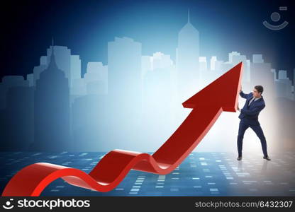 Businessman supporting growtn in economy on chart graph