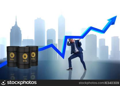 Businessman supporting oil price in business concept