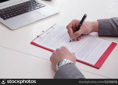 Businessman taking notes at the meeting