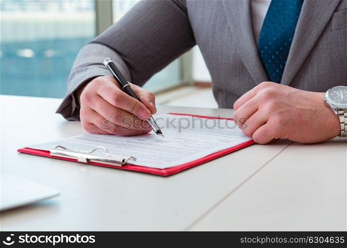 Businessman taking notes at the meeting