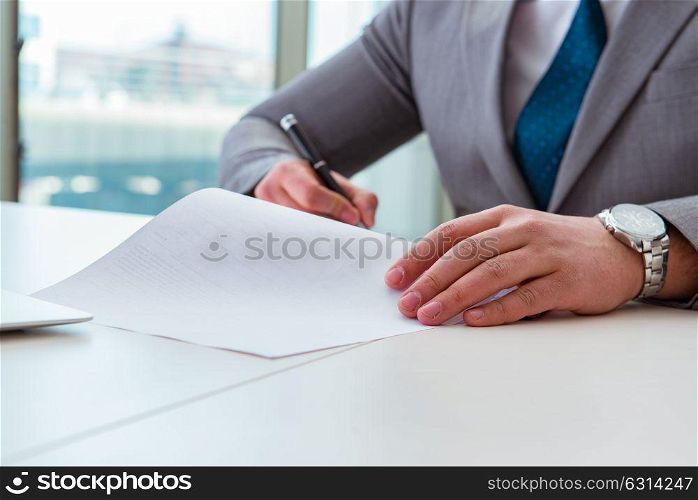 Businessman taking notes at the meeting