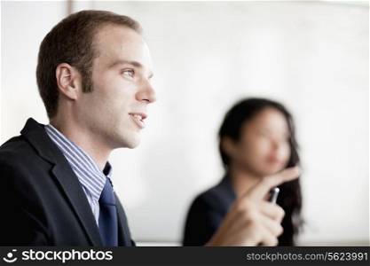 Businessman talking and gesturing at a business meeting
