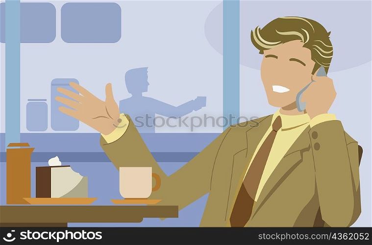 Businessman talking on a mobile phone in a cafe