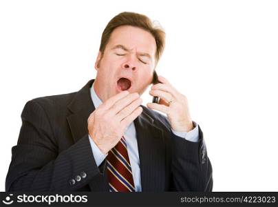Businessman talking on his cellphone is yawning from boredom and exhaustion. Isolated on white.