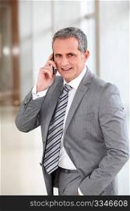 Businessman talking on the phone in offices building