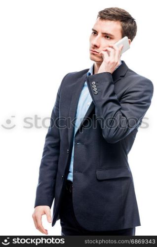 Businessman talking on the phone on a white background