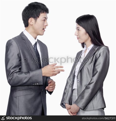 Businessman talking to businesswoman