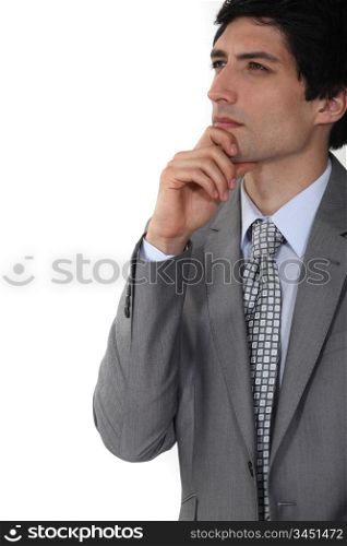 businessman thinking and holding his chin
