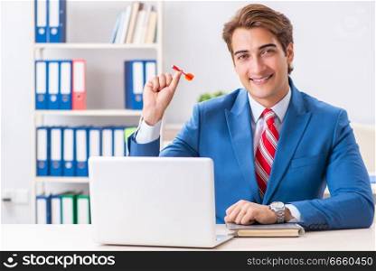 Businessman throwing dart in business concept