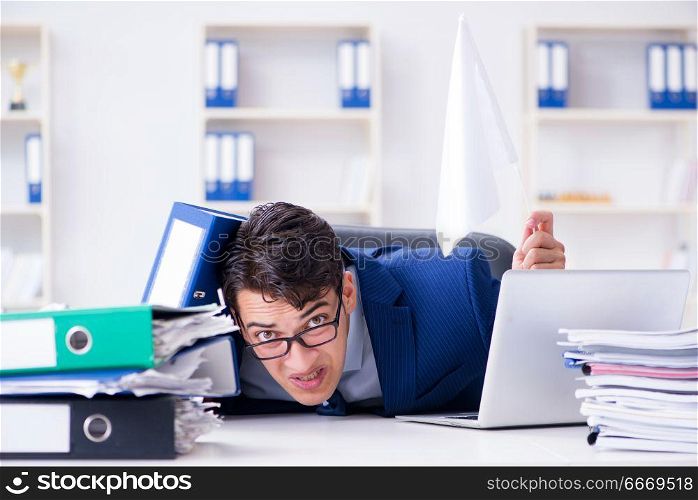 Businessman throwing white flag and giving up