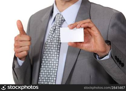 businessman thumb up showing business card