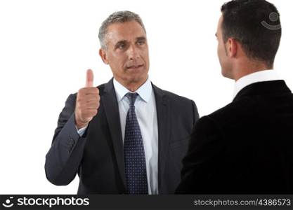 Businessman thumb up with