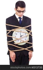Businessman tied to clock on white