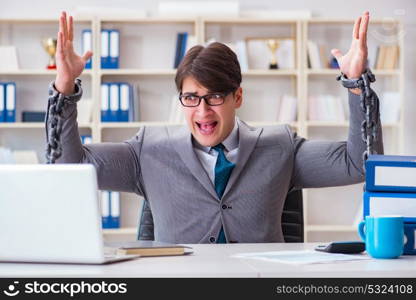 Businessman tied with chains to his work