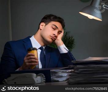 Businessman tired and sleeping in the office after overtime hours. The businessman tired and sleeping in the office after overtime