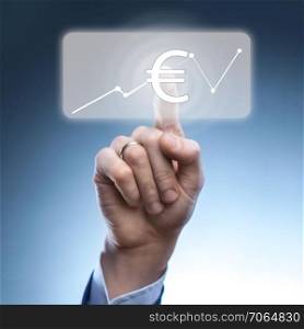 Businessman touched euro currency icon on virtual financial screen.A graph indicating growth.Finance and technology concept.. Businessman touched euro currency icon