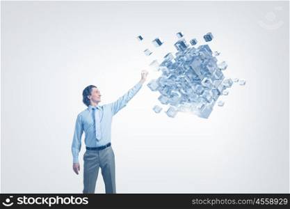 Businessman touching cube . Businessman reaching hand to touch digital cube figure