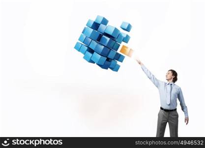 Businessman touching cube . Businessman reaching hand to touch digital cube figure