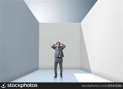 Businessman trying to escape from difficult situation
