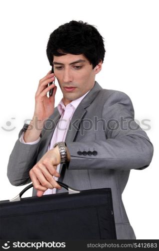 Businessman trying to stay on schedule