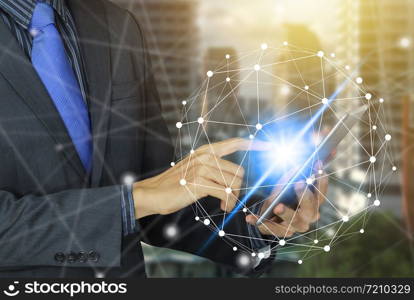 Businessman use tablet with virtual screen over the Network connection technology.