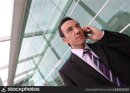 Businessman using a cellphone in the city