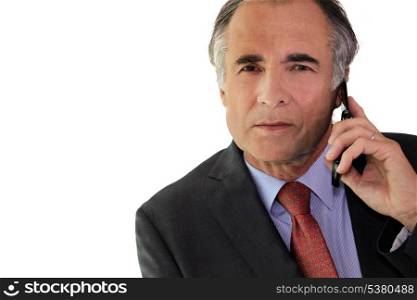 Businessman using a cellphone in the office