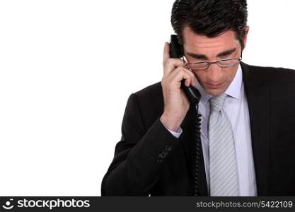 Businessman using a landline
