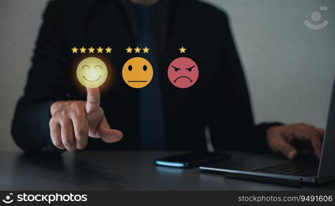 Businessman using a virtual screen to assess customer satisfaction and service quality by pointing to the highest level smiley face icon, ensuring positive feedback