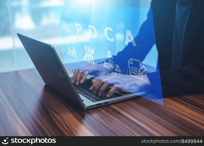 Businessman using computer searching online internet for business PDCA plan do check Act concept