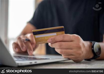 businessman using credit card and laptop to login to internet bank.Online shopping, e-commerce, internet banking, and financial transactions payments via e-bank application concept.
