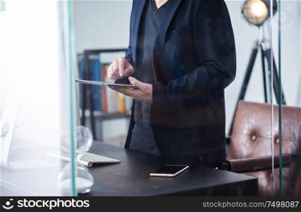 Businessman using digital tablet to work