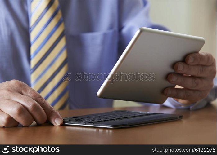 Businessman Using Digital Tablet With Detachable Keyboard