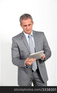 Businessman using electronic tab