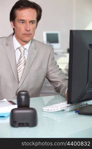 Businessman using his computer