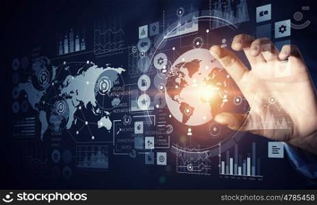 Businessman using innovative technologies. Close up of businessman touching virtual panel with finger